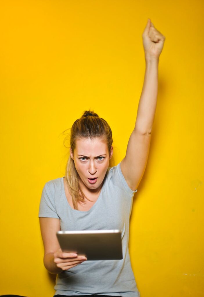 photo of a woman holding an ipad