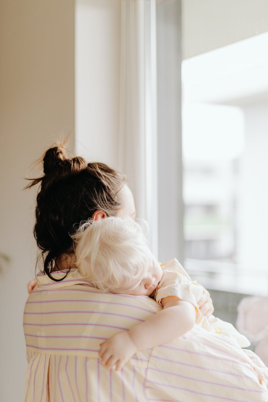 woman carrying her baby