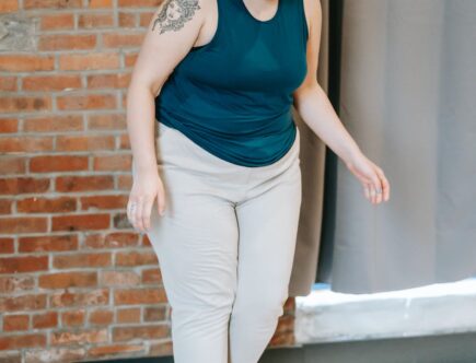 overweight woman standing on scales