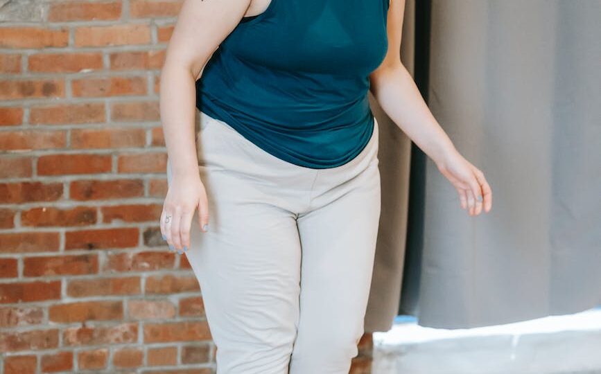 overweight woman standing on scales